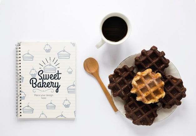 Free Top View Of Waffles With Coffee And Notebook Psd
