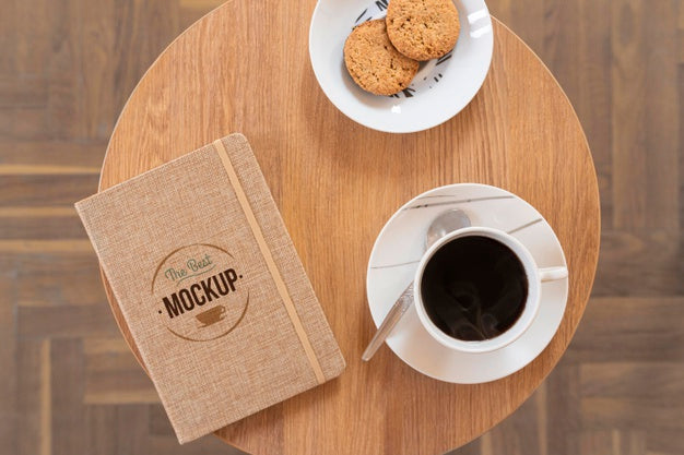 Free Top View On Cup Of Coffee With Notebook Mockup Psd