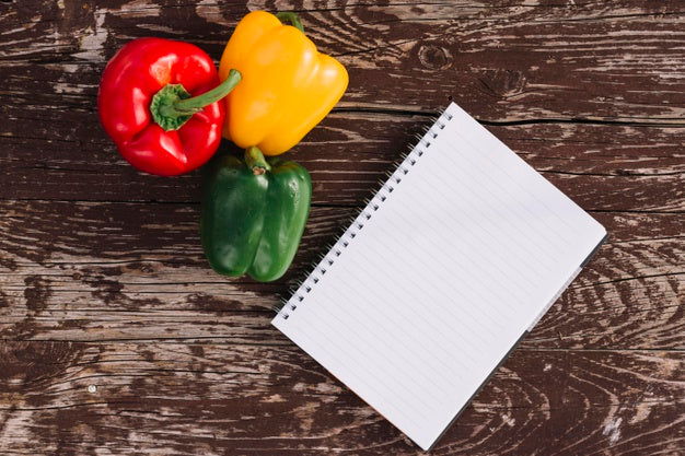 Free Top View Peppers With Notebook Psd