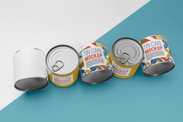 Free Top View Tin Cans Arranged On Table Psd