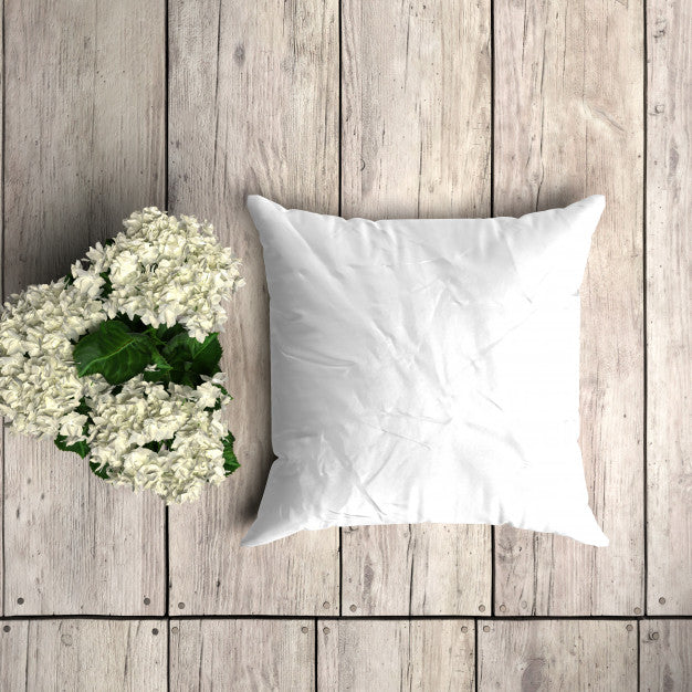 Free White Pillowcase Mockup On A Wooden Plank With Floral Decoration Psd