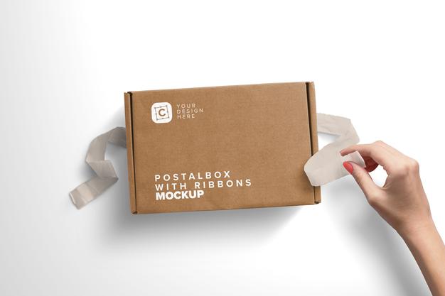 Free Woman Hand Opening Postal Box With Ribbons Mockup Psd