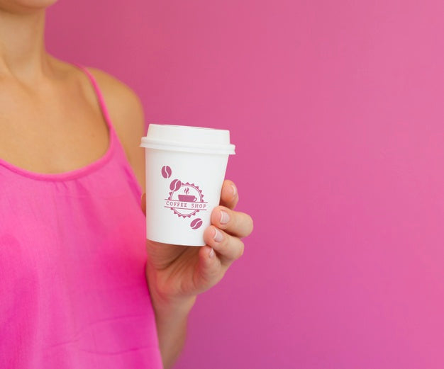 Free Woman Holding Paper Coffee Cup Mock-Up With Copy Space Psd
