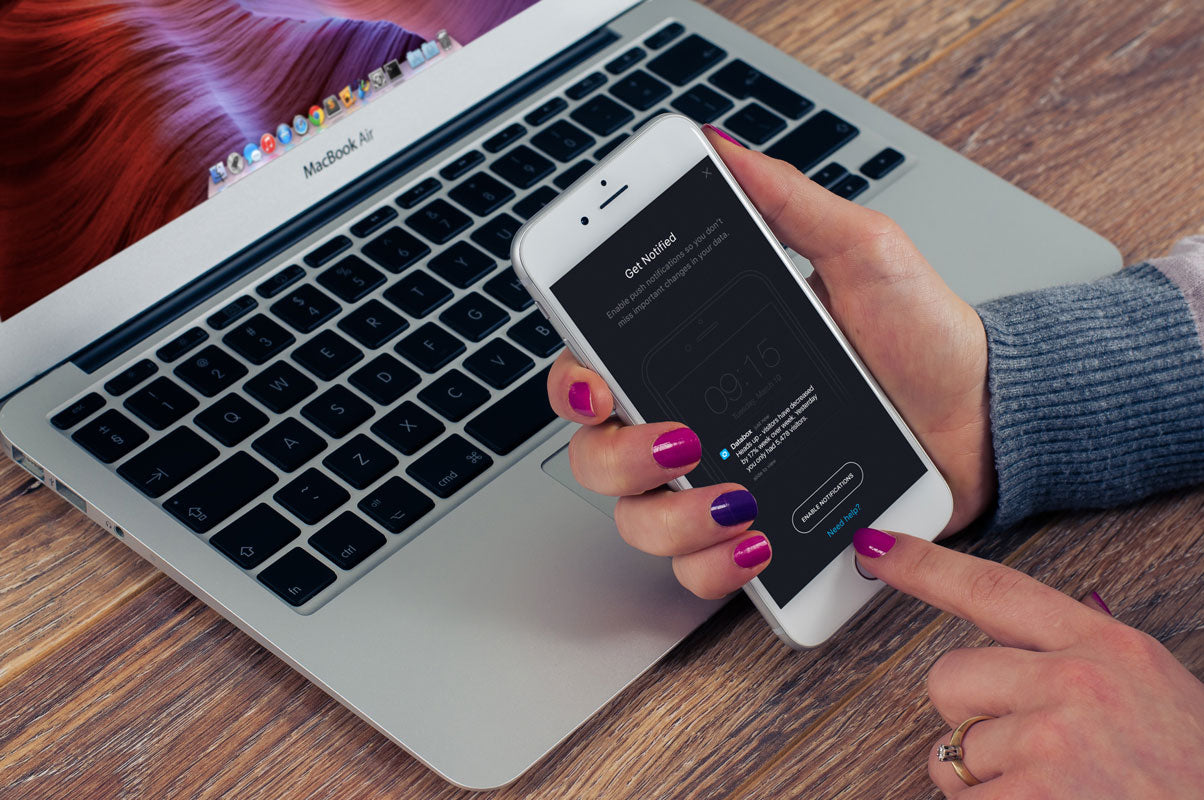 Free Woman with iPhone 8 Mockup in Her Hand