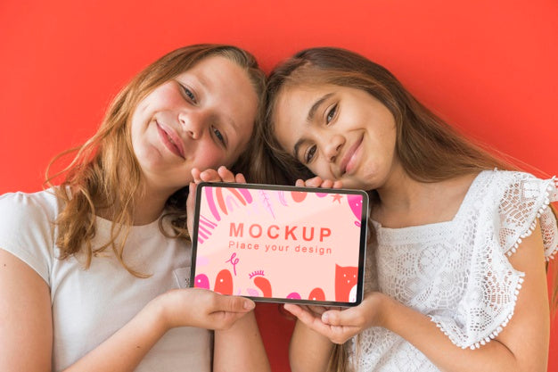 Free Young Girls Holding Phone With Mock-Up Psd