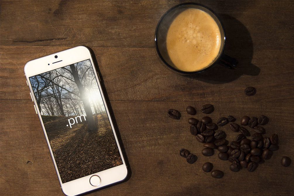 Free iPhone 6 Coffee Mug Table Scene PSD Mockup