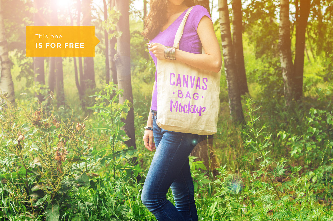 Free Woman Holding a Canvas Bag PSD Mockup