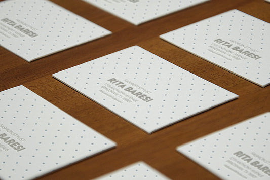Free Perspective View of Business Cards Mockup on Wooden Surface