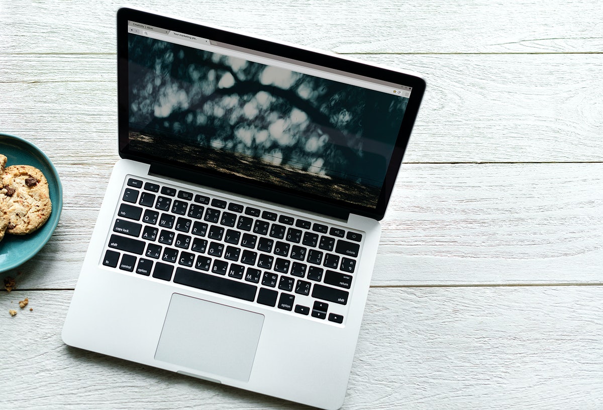 Free Aerial View Of Computer Laptop And Cookies On Wooden Table