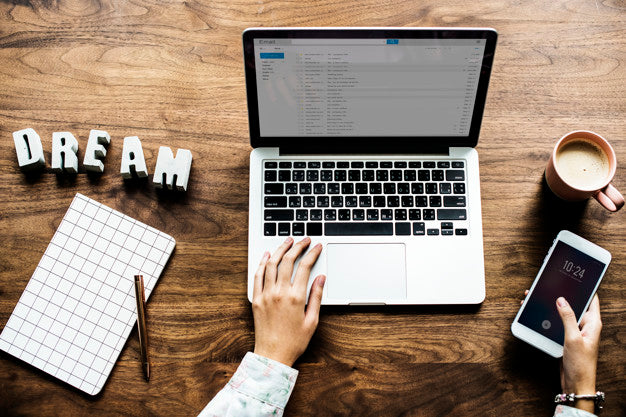 Free Aerial View Of Computer Laptop On Wooden Table Psd