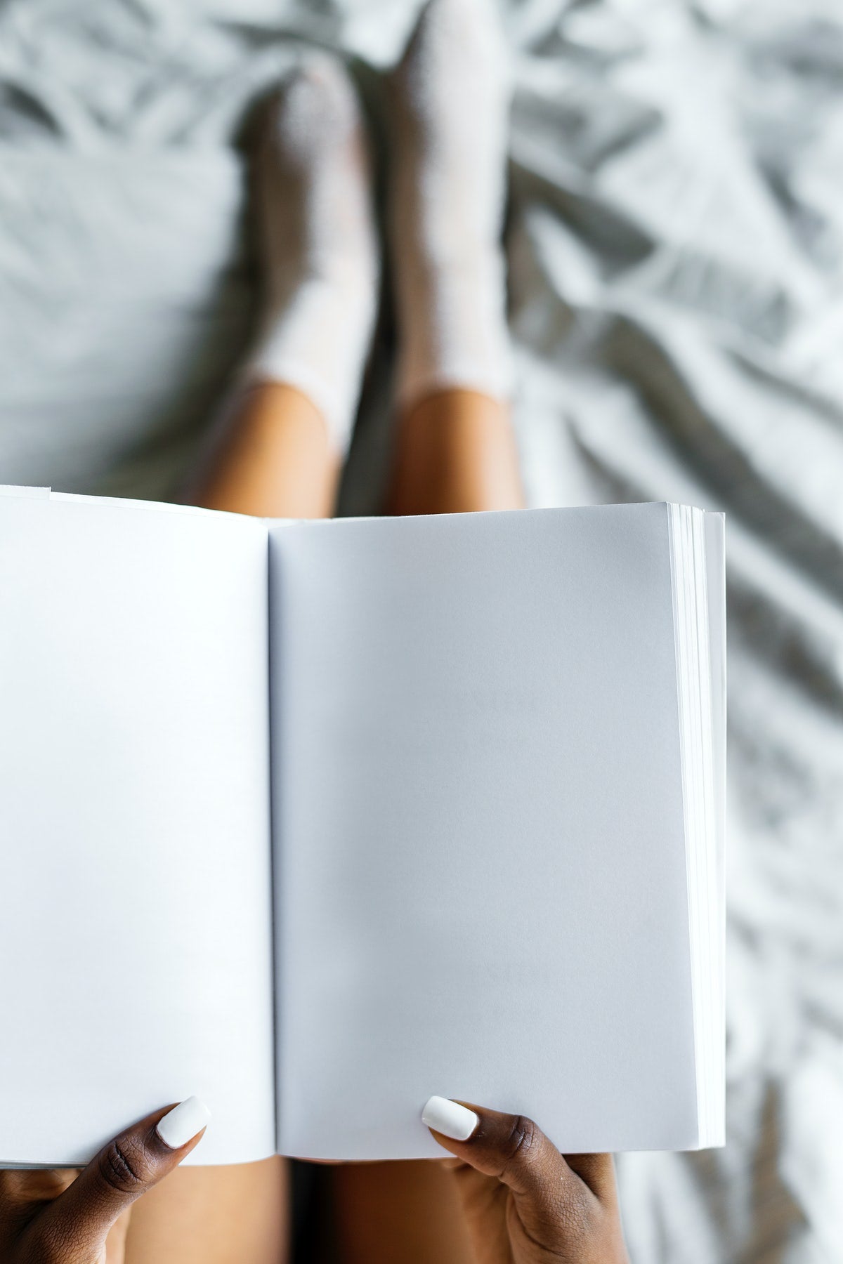 Free Aerial View Of Woman Holding Blank Diary