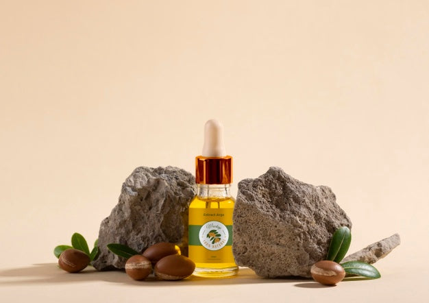 Free Argan Oil Cosmetic Bottle Mock-Up With Rock Psd