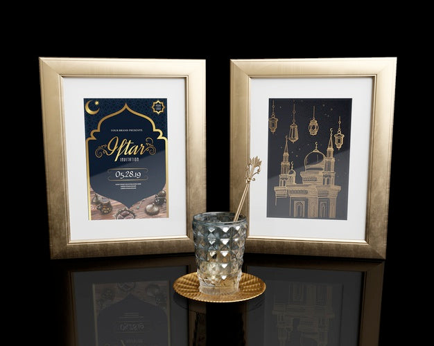 Free Arrangement With Frames And Glass On Black Table Psd