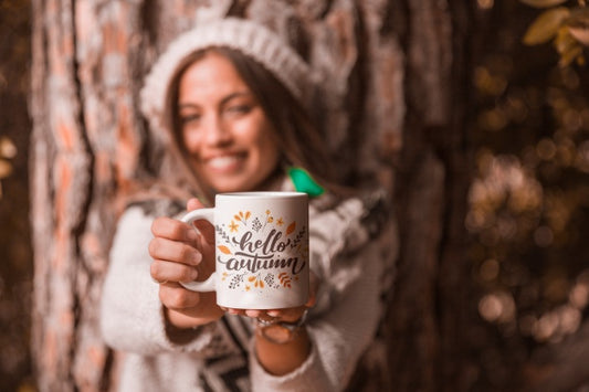 Free Autumn Concept With Woman Holding Mug Psd