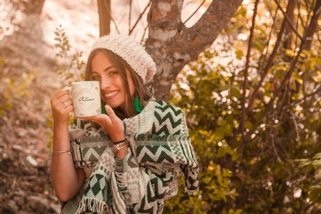 Free Autumn Concept With Woman Holding Mug Psd