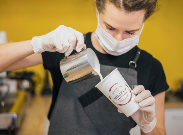 Free Barista Pouring Milk In Coffee Cup Psd