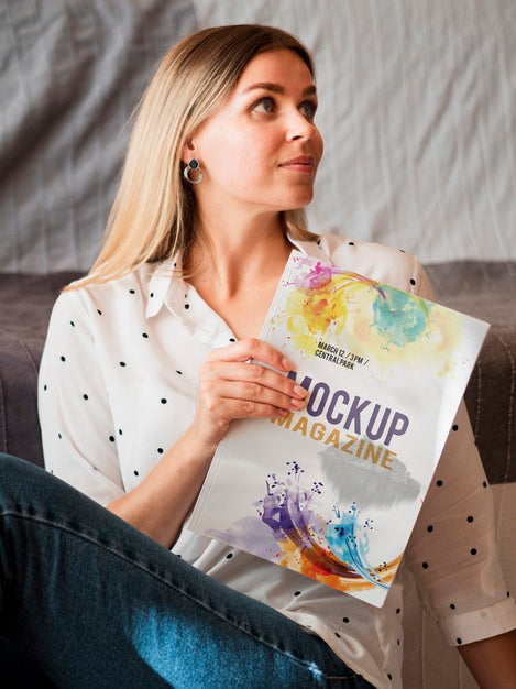 Free Beautiful Woman Holding A Mock Up Magazine Psd