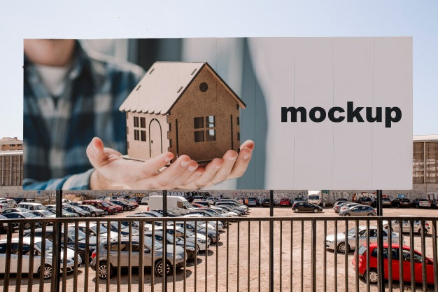 Free Billboard Mockup In Front Of Parking Lot Psd