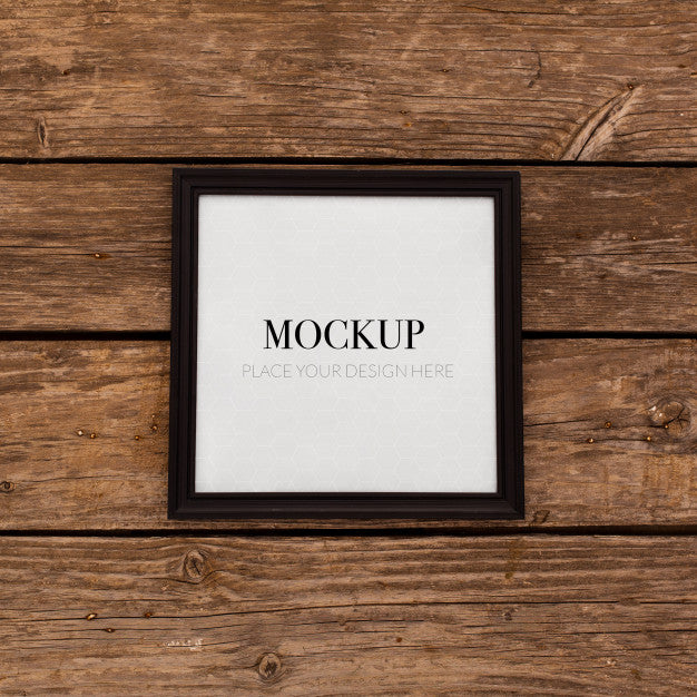 Free Black Frame Mockup On Retro Wood Psd