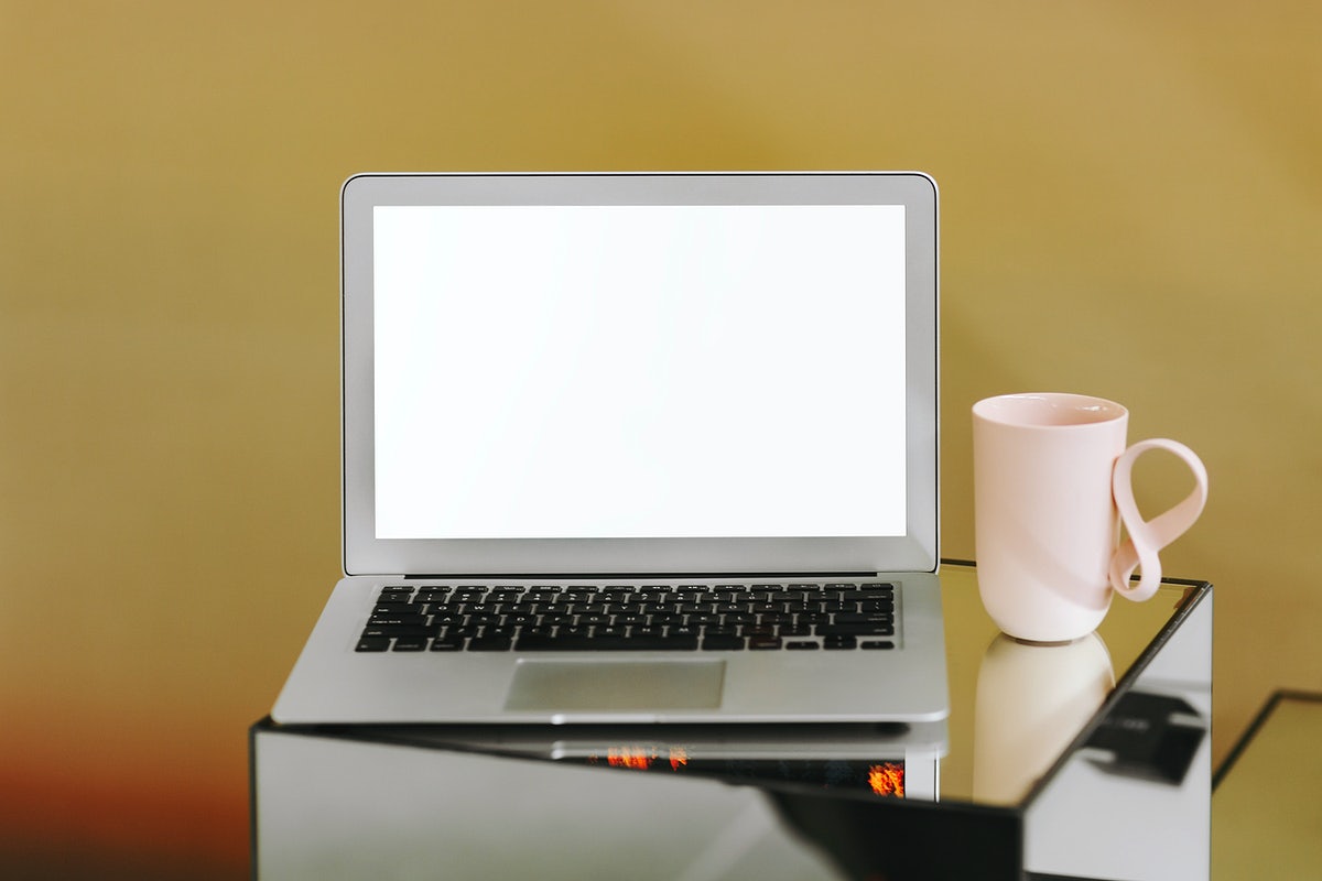 Free Blank Laptop Screen And A Pink Coffee Cup