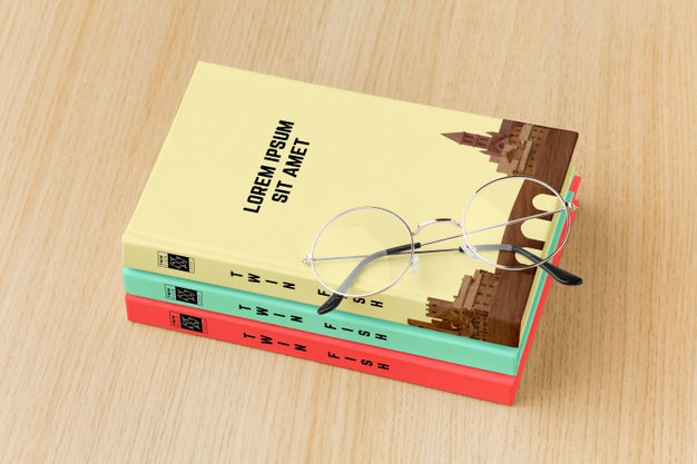 Free Book Cover Assortment On Wooden Background Psd