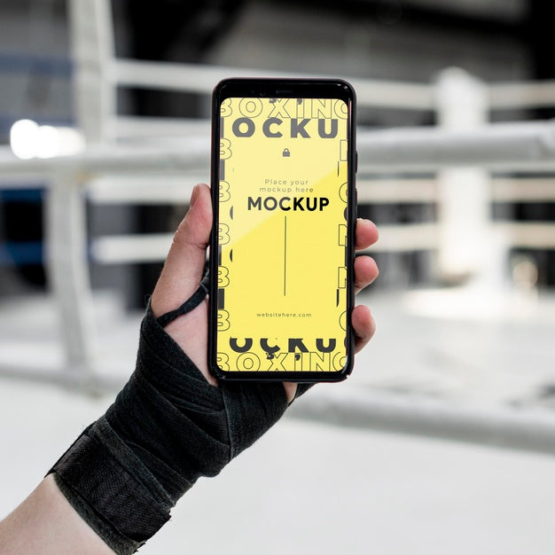 Free Boxing Athlete Holding A Mock-Up Phone Psd