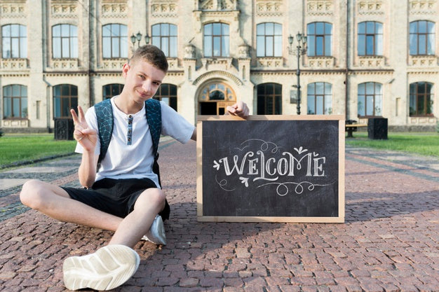 Free Boy Holding A Blackboard Mock-Up Psd