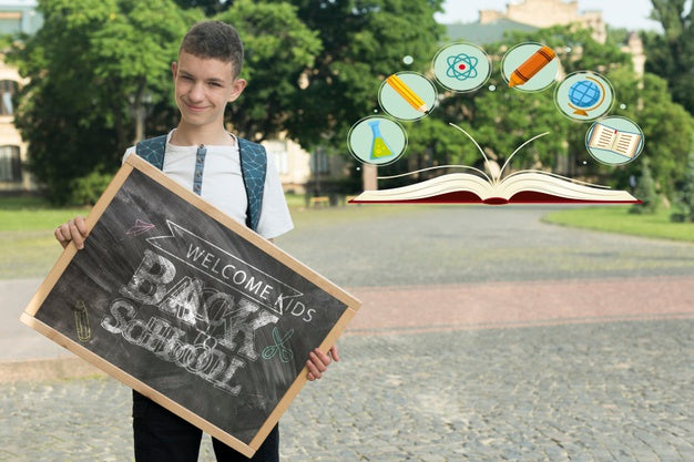 Free Boy Holding A Blackboard Mock-Up Psd