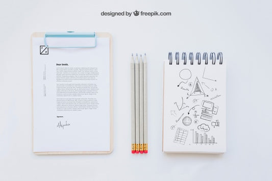 Free Business Composition With Clipboard, Pencils And Notebook Psd