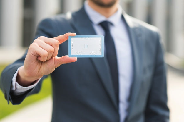 Free Businessman Holding Business Card Mockup Psd