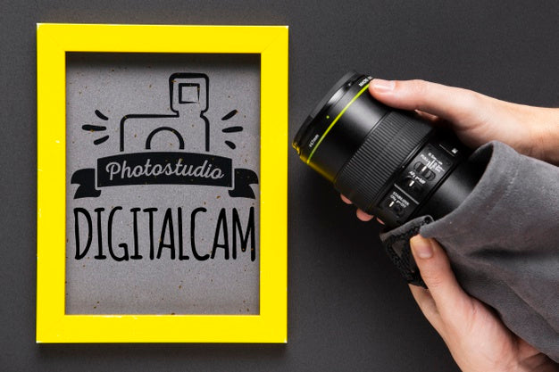 Free Camera Beside Frame With Studio Logo Psd