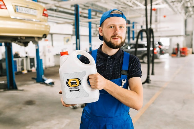 Free Car Mechanic Holding Plastic Can Mockup Psd