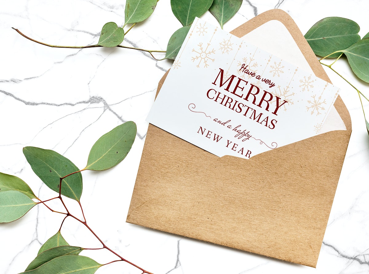 Free Card In An Envelope Mockup With Leaves In The Background