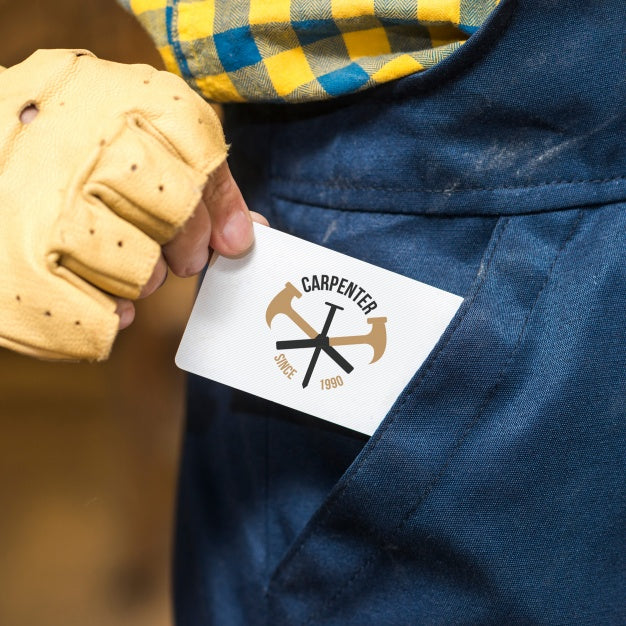 Free Carpenter Holding Business Card Mockup Psd