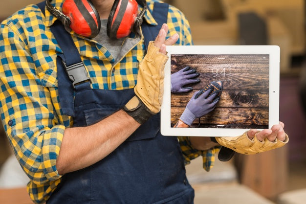 Free Carpenter Holding Tablet Mockup Psd