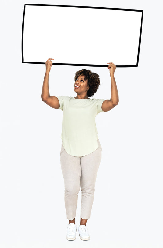 Free Cheerful Woman Showing A Blank White Banner