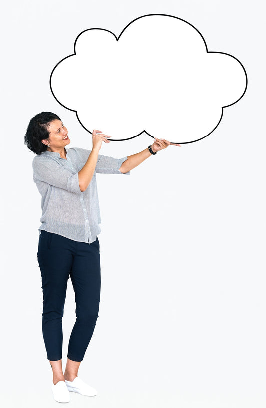 Free Cheerful Woman Showing A Blank White Cloud