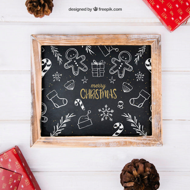 Free Christmas Mockup With Slate Between Presents Psd