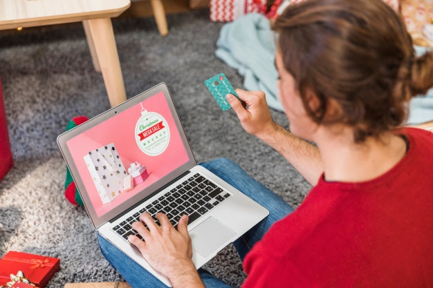 Free Christmas Sale Mockup With Woman Using Laptop Psd