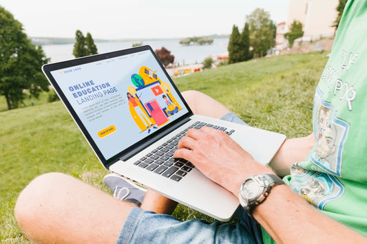 Free Close-Up Male Working On Laptop Outdoors Psd