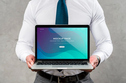 Free Close-Up Man Holding Laptop Psd