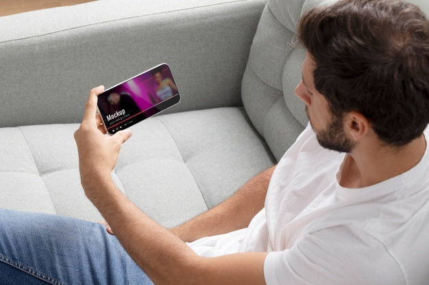 Free Close Up Man Watching Movie On Smartphone Psd