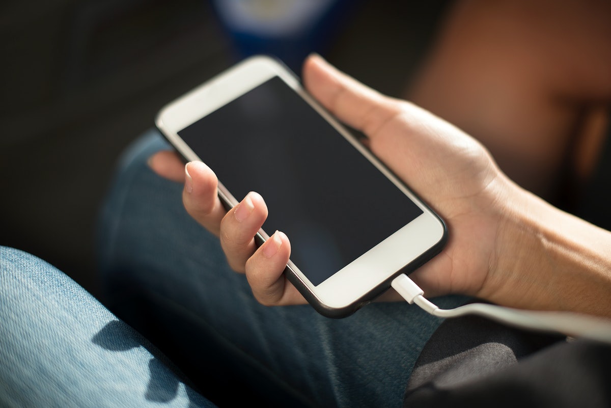 Free Close Up Of Hands Charging Mobile Phone