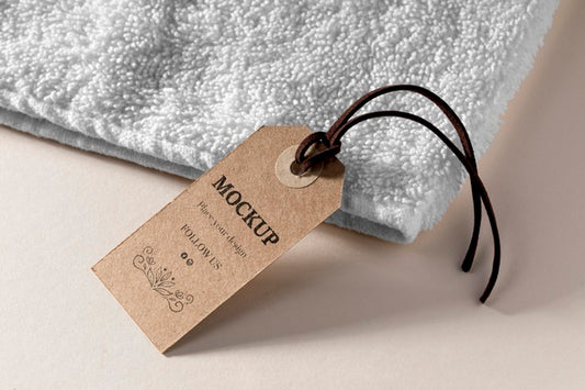 Free Clothing Mock-Up Tag With Thread On Towel Psd