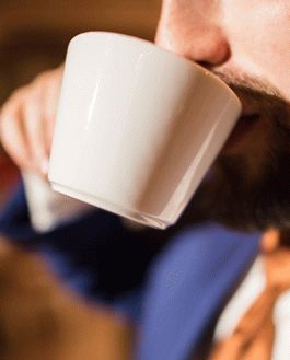 Free Coffee Cup And A Man In A Suit Mockup