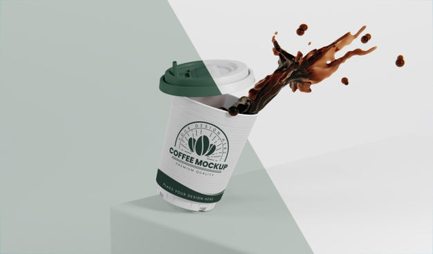 Free Composition Of Paper Coffee Cup With Coffee Splash Psd