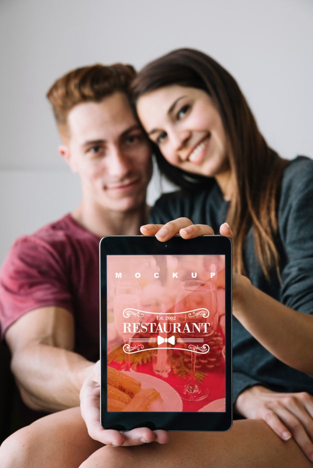 Free Couple Holding Tablet Mockup For Valentine Psd