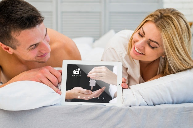 Free Couple In Bed With Tablet Mockup For Valentine Psd