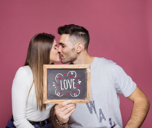 Free Couple Presenting Slate Mockup Psd