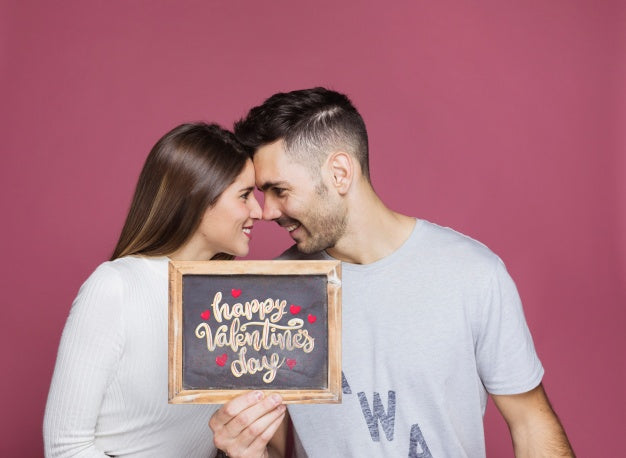 Free Couple Presenting Slate Mockup Psd